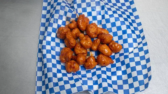 Butter Chicken Pizza - non-veg specialty combining butter chicken flavours in NE Calgary